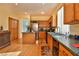 Well-equipped kitchen with wood cabinets and a large island at , Las Vegas, NV 89148