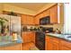 Well-equipped kitchen with wood cabinets and stainless steel appliances at , Las Vegas, NV 89148