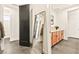 Bright hallway with a full-length mirror and light wood cabinets at 12103 Canyon Sunset St, Las Vegas, NV 89138