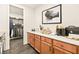 Bright laundry room with light wood cabinets and modern appliances at 12103 Canyon Sunset St, Las Vegas, NV 89138