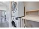 Stackable washer and dryer in a functional laundry room at 1374 Coppelia Ct, Henderson, NV 89052