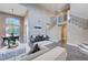 Two-story living room with gray walls, hardwood floors, and a staircase at 1374 Coppelia Ct, Henderson, NV 89052