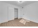 Spacious bedroom with light wood flooring and large closet at 2028 Hassell Ave, North Las Vegas, NV 89032