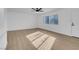 Bright and airy living room with light wood flooring at 2028 Hassell Ave, North Las Vegas, NV 89032