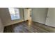 Bedroom with wood-look flooring and access to bathroom at 2300 E Silverado Ranch Blvd # 1151, Las Vegas, NV 89183