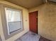 Apartment entryway with red door and window at 2300 E Silverado Ranch Blvd # 1151, Las Vegas, NV 89183