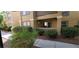 Tan colored building exterior with landscaping and walkway at 2300 E Silverado Ranch Blvd # 1151, Las Vegas, NV 89183