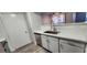 Kitchen with white cabinets, quartz countertops, and stainless steel sink and dishwasher at 2300 E Silverado Ranch Blvd # 1151, Las Vegas, NV 89183