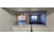 Kitchen view of living room with sliding glass doors to patio at 2300 E Silverado Ranch Blvd # 1151, Las Vegas, NV 89183