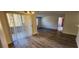 Living room with hardwood floors, patio access, and ceiling fan at 2300 E Silverado Ranch Blvd # 1151, Las Vegas, NV 89183