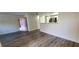 Open living room with kitchen and patio access at 2300 E Silverado Ranch Blvd # 1151, Las Vegas, NV 89183
