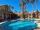 Beautiful community pool area with palm trees and lounge chairs, perfect for relaxation at 2300 E Silverado Ranch Blvd # 1151, Las Vegas, NV 89183