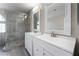 Bathroom featuring a double vanity and a large glass-enclosed shower at 273 Adorno Dr, Henderson, NV 89074