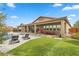 Landscaped backyard with patio, pool, and seating area at 286 Chartan Ave, Las Vegas, NV 89183