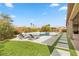 Relaxing backyard oasis with pool, lawn, and lounge chairs at 286 Chartan Ave, Las Vegas, NV 89183