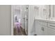 Bright bathroom boasts a vanity with white cabinets and a walk-in shower at 286 Chartan Ave, Las Vegas, NV 89183