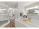 Bright bathroom boasts a large soaking tub, walk-in shower, and modern fixtures at 286 Chartan Ave, Las Vegas, NV 89183