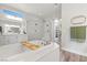 Spa-like bathroom featuring a soaking tub, walk-in shower, and ample storage at 286 Chartan Ave, Las Vegas, NV 89183