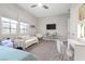 Bright bedroom with a comfy couch, workspace, and plenty of natural light at 286 Chartan Ave, Las Vegas, NV 89183