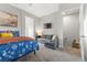 Comfortable bedroom with a queen bed, sofa, and built-in shelving at 286 Chartan Ave, Las Vegas, NV 89183