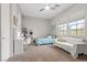 Spacious bedroom featuring a bed, desk, sofa, and ample natural light at 286 Chartan Ave, Las Vegas, NV 89183