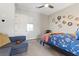Cozy bedroom with a full bed and a gray sofa at 286 Chartan Ave, Las Vegas, NV 89183
