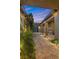 Elegant courtyard entry with string lights and a fireplace at 286 Chartan Ave, Las Vegas, NV 89183