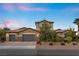 Two-story house with gray siding, three-car garage, and landscaping at 286 Chartan Ave, Las Vegas, NV 89183