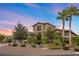 Two-story house with landscaped yard and palm trees at 286 Chartan Ave, Las Vegas, NV 89183