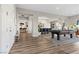 Open concept living space with a pool table, dining table and access to backyard at 286 Chartan Ave, Las Vegas, NV 89183