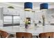 Modern kitchen island with seating, stainless steel appliances, and white cabinetry at 286 Chartan Ave, Las Vegas, NV 89183