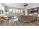 Living room with a large curved sectional sofa and plenty of natural light at 286 Chartan Ave, Las Vegas, NV 89183