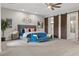 Main bedroom with barn doors, ceiling fan, and a sitting area at 286 Chartan Ave, Las Vegas, NV 89183