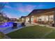 Evening view of a luxurious pool, spa, and patio area at 286 Chartan Ave, Las Vegas, NV 89183