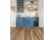 Modern wet bar with blue cabinets, wood shelving, and wine cooler at 286 Chartan Ave, Las Vegas, NV 89183