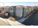 Two-story house with gray exterior and landscaping at 2905 Bahama Yellow Ave, North Las Vegas, NV 89086
