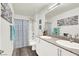 Modern bathroom with dual sinks and a shower/tub combo at 2905 Bahama Yellow Ave, North Las Vegas, NV 89086
