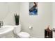 Clean and modern half bathroom with white sink and toilet at 2905 Bahama Yellow Ave, North Las Vegas, NV 89086