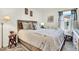 Cozy bedroom with wood-framed bed and window seat at 2905 Bahama Yellow Ave, North Las Vegas, NV 89086