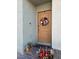 Modern front door with a wreath and potted plants at 2905 Bahama Yellow Ave, North Las Vegas, NV 89086