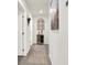 Bright hallway with decorative wall art and a runner at 2905 Bahama Yellow Ave, North Las Vegas, NV 89086