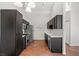 Kitchen with dark cabinets, stainless steel appliances, and tile floors at 3540 Cactus Shadow St # 201, Las Vegas, NV 89129