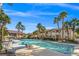 Community pool with lounge chairs and seating area at 3540 Cactus Shadow St # 201, Las Vegas, NV 89129