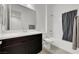 Bright bathroom featuring a spacious vanity with modern finishes and a shower with a tub at 395 Nine Mile Creek Dr, Las Vegas, NV 89138
