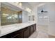Modern bathroom with double vanity, quartz countertop, and large walk-in shower with beautiful tiling at 395 Nine Mile Creek Dr, Las Vegas, NV 89138