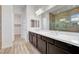 Bathroom with double sink vanity and large glass shower at 395 Nine Mile Creek Dr, Las Vegas, NV 89138
