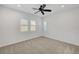 Bedroom with a ceiling fan and neutral carpet at 395 Nine Mile Creek Dr, Las Vegas, NV 89138