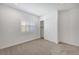 Bedroom with carpeted floors, a window with shutters, and closet with sliding doors at 395 Nine Mile Creek Dr, Las Vegas, NV 89138