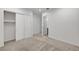 Bedroom with carpeted floors, closet, recessed lights, and access to en suite bathroom at 395 Nine Mile Creek Dr, Las Vegas, NV 89138