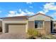 Charming single-story home with a two-car garage, brick accents, and well-maintained landscaping at 395 Nine Mile Creek Dr, Las Vegas, NV 89138